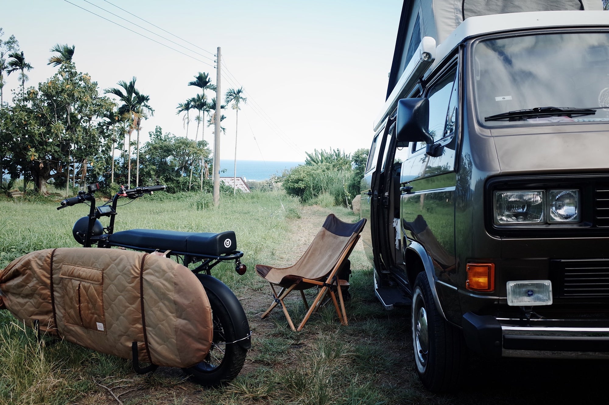 Cool electric bike by UD Bikes / Urban Drivesytle with a surfboard rack for surfing and van life