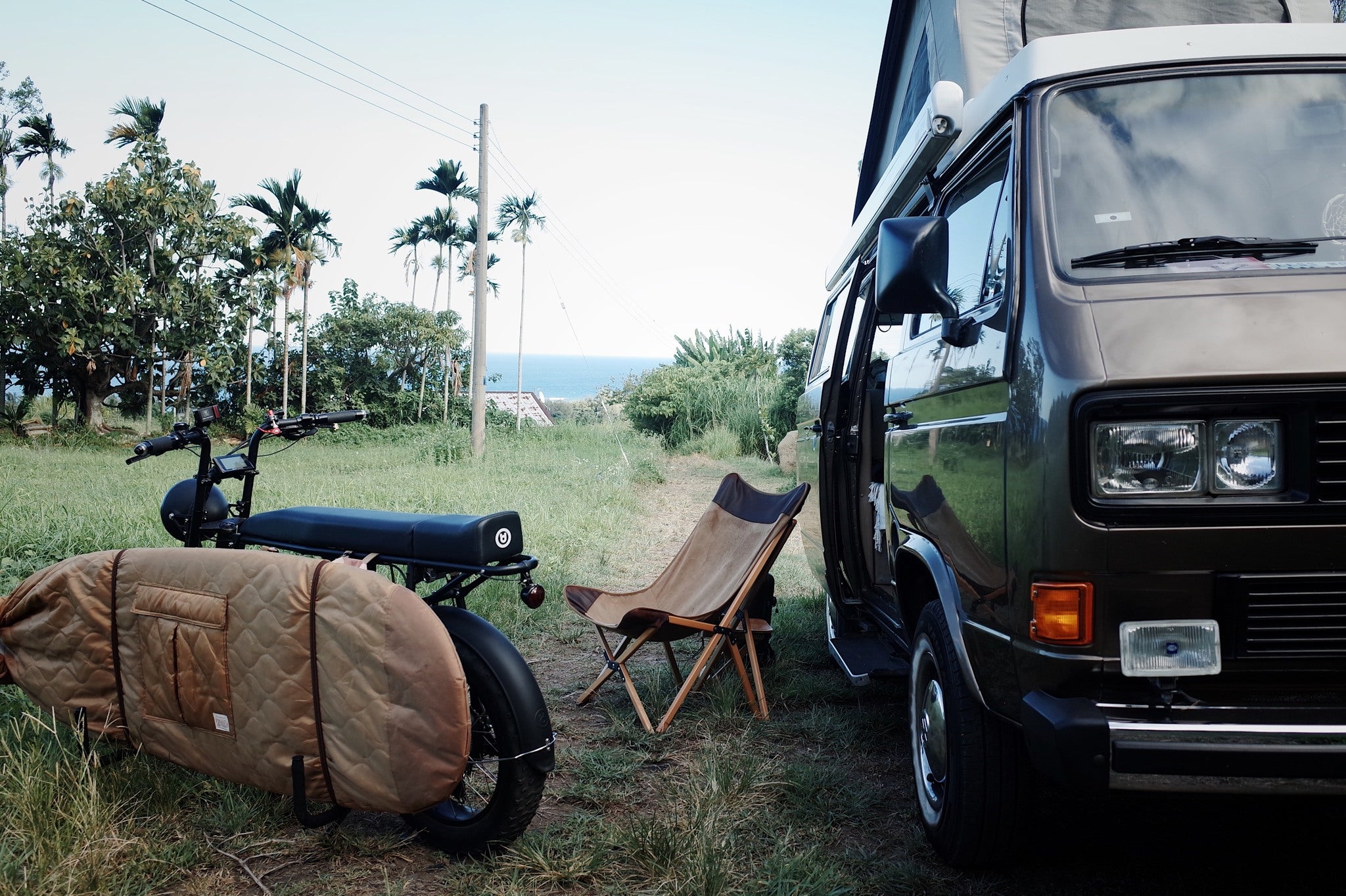 Cool electric bike by UD Bikes / Urban Drivesytle with a surfboard rack for surfing and van life